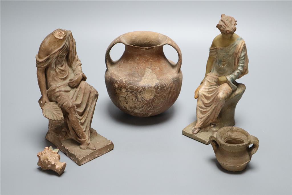 An ancient pottery two handled jar, a.f., two late 19th century terracotta models of classical figures a.f. and a pottery ointment jar